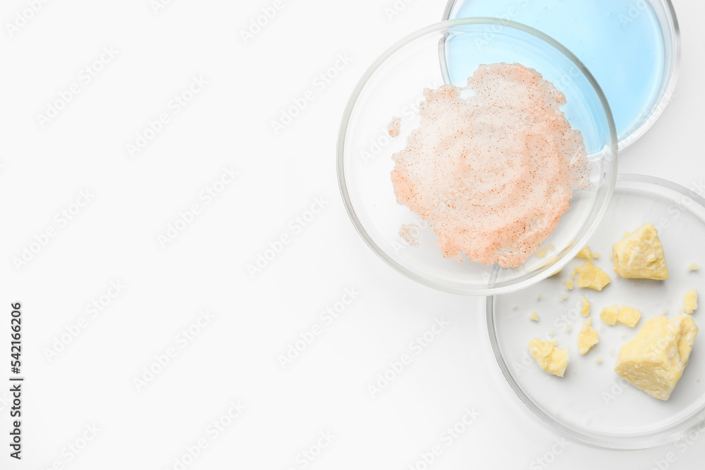 Many Petri dishes and cosmetic products on white background, top view Many Petri dishes and cosmetic products on white background, top view