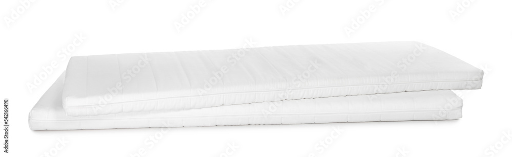 Fototapeta premium Two new comfortable mattresses isolated on white