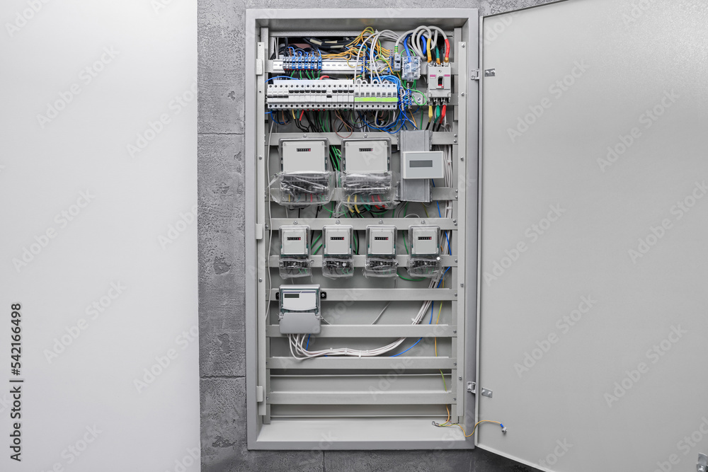 Fuse box with many electric meters and wires Fuse box with many electric meters and wires