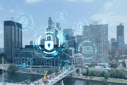 Aerial panorama city view of Philadelphia financial downtown at day time, Pennsylvania, USA. Glowing Padlock hologram. The concept of cyber security to protect companies confidential information