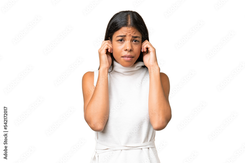 Young African american woman over isolated background frustrated and covering ears Young African american woman over isolated background frustrated and covering ears