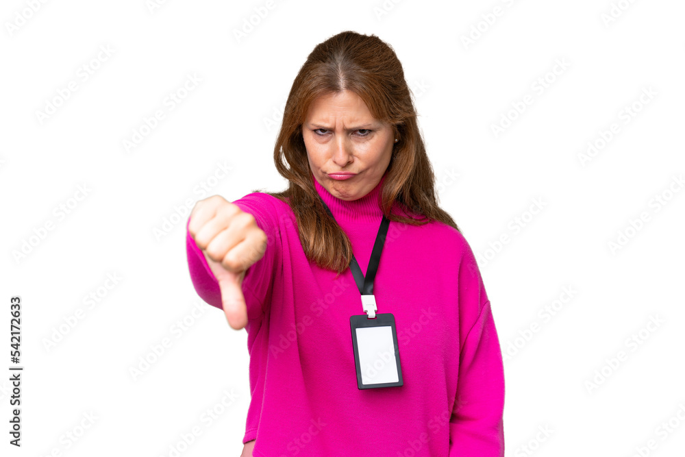 Middle-aged caucasian woman with ID card over isolated background showing thumb down with negative expression Middle-aged caucasian woman with ID card over isolated background showing thumb down with negative expression