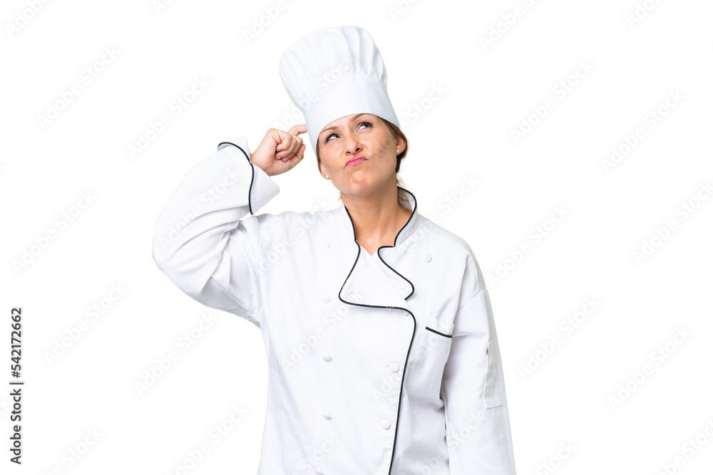 Middle-aged chef woman over isolated background having doubts and with confuse face expression Middle-aged chef woman over isolated background having doubts and with confuse face expression