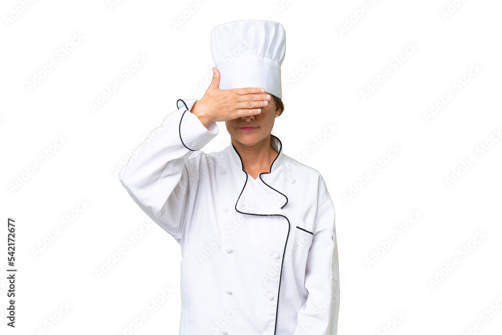 Middle-aged chef woman over isolated background covering eyes by hands. Do not want to see something