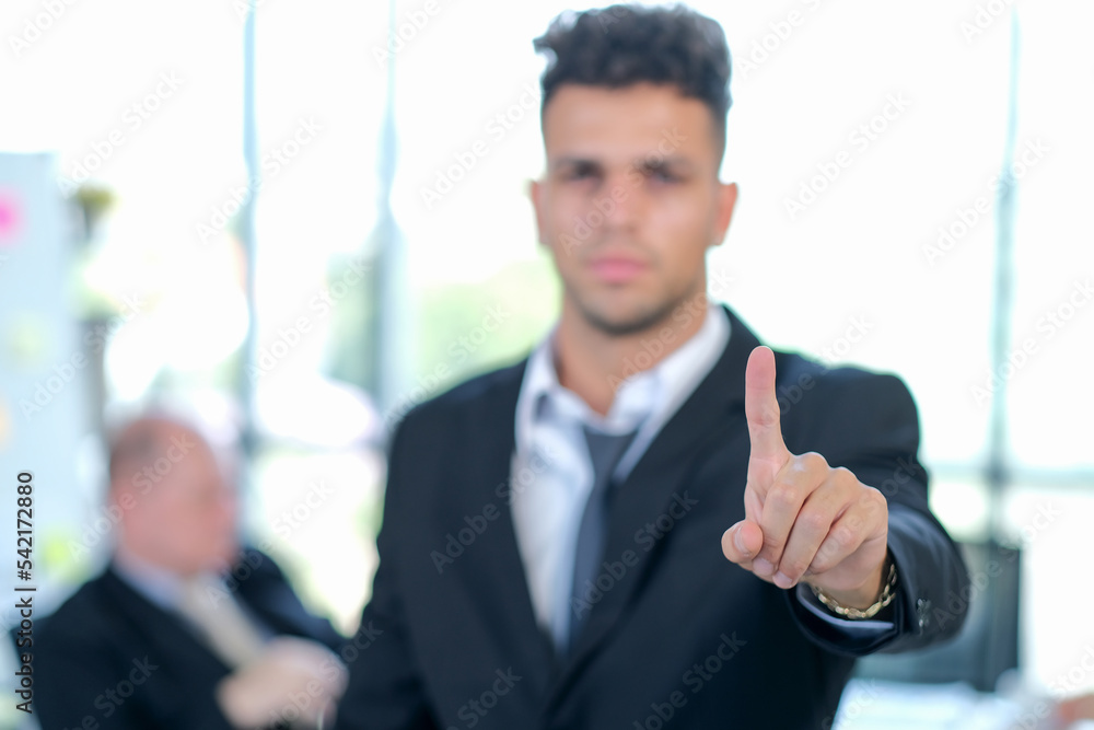 Businessman hand touching empty virtual screen, blank background, selective focus.- can be used for montage your text or pictures at the finger. Businessman hand touching empty virtual screen, blank background, selective focus.- can be used for montage your text or pictures at the finger.