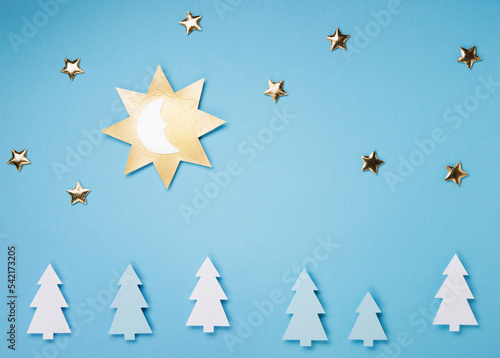 Winter Solstice Day Holiday, December 21. Sun, Moon, Golden Stars on Blue Background © Iuliia Metkalova