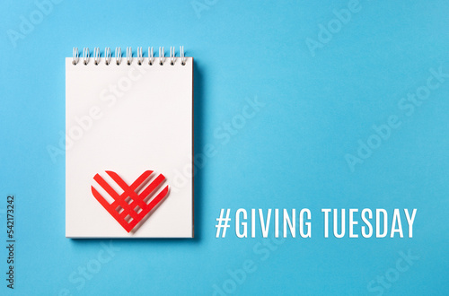 Giving Tuesday, Global Day of Charitable Giving after Black Friday shopping day concept on blue background. photo