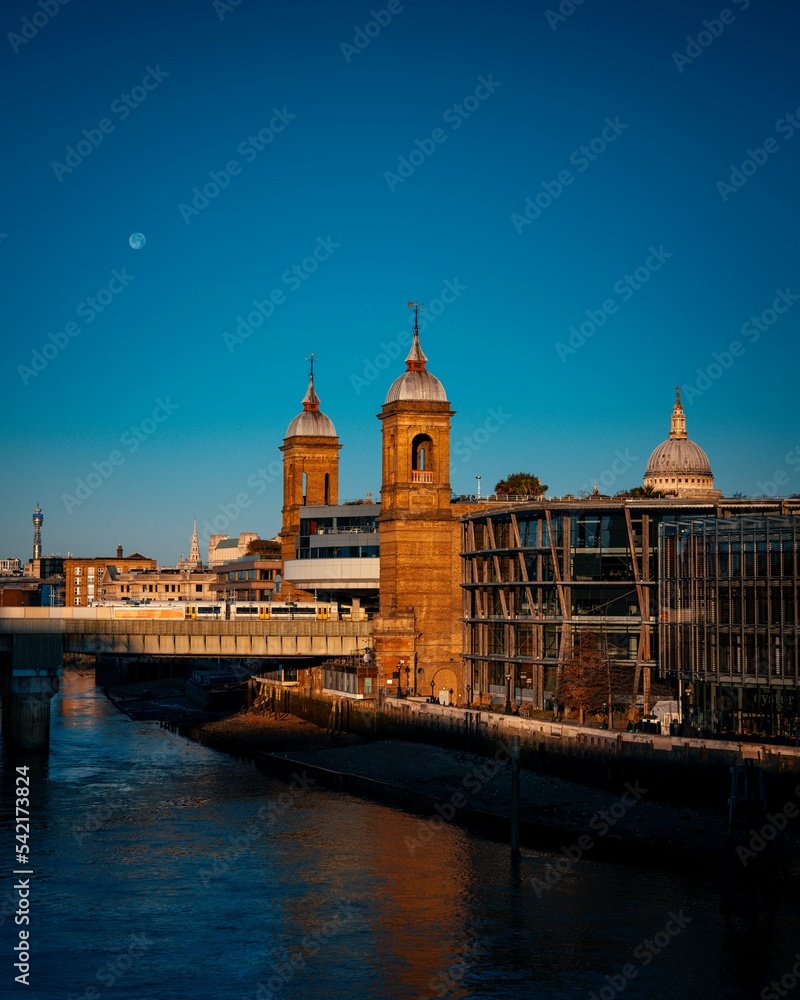 Cannon Street Railway Bridge in London and the full moon in the blue sky Cannon Street Railway Bridge in London and the full moon in the blue sky