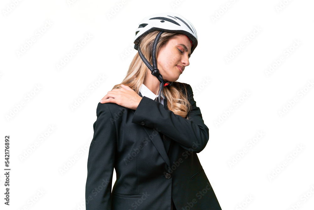 Business Uruguayan woman wearing a helmet biker over isolated background suffering from pain in shoulder for having made an effort Business Uruguayan woman wearing a helmet biker over isolated background suffering from pain in shoulder for having made an effort