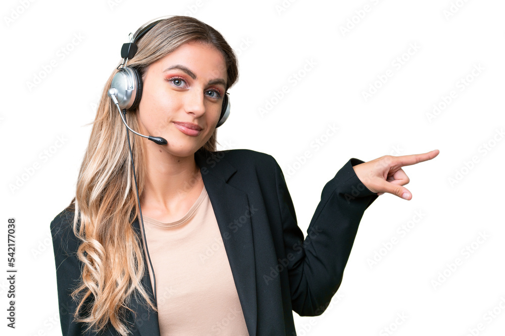 Telemarketer pretty Uruguayan woman working with a headset over isolated background pointing finger to the side Telemarketer pretty Uruguayan woman working with a headset over isolated background pointing finger to the side