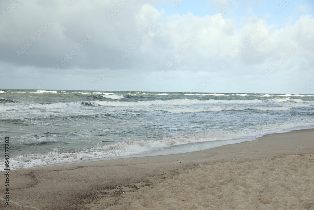Picturesque view of wavy sea on cloudy day Picturesque view of wavy sea on cloudy day
