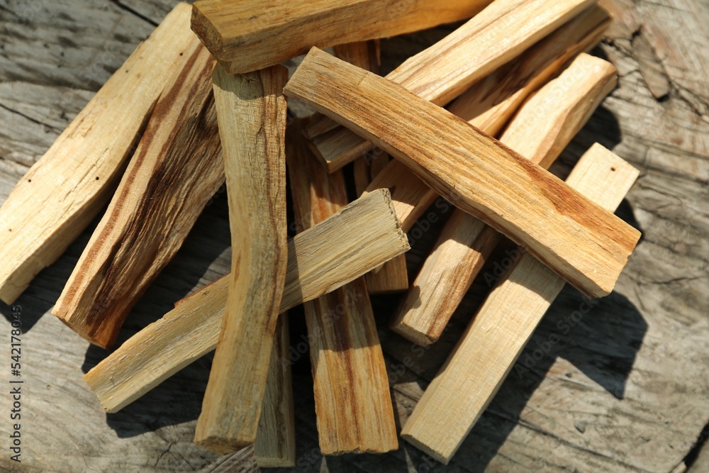 Palo santo sticks on wooden table, top view Palo santo sticks on wooden table, top view
