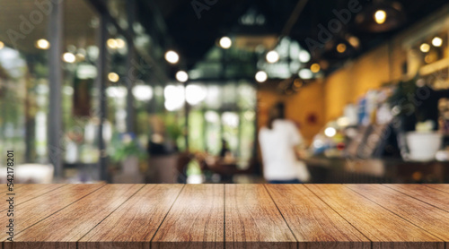 Wallpaper Mural Empty wooden table top with lights bokeh on blur restaurant background.	
 Torontodigital.ca
