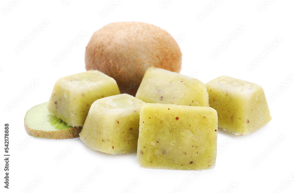 Frozen kiwi puree cubes and fruit on white background Frozen kiwi puree cubes and fruit on white background