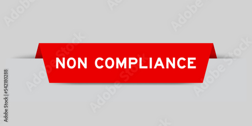 Red color inserted label with word non compliance on gray background
