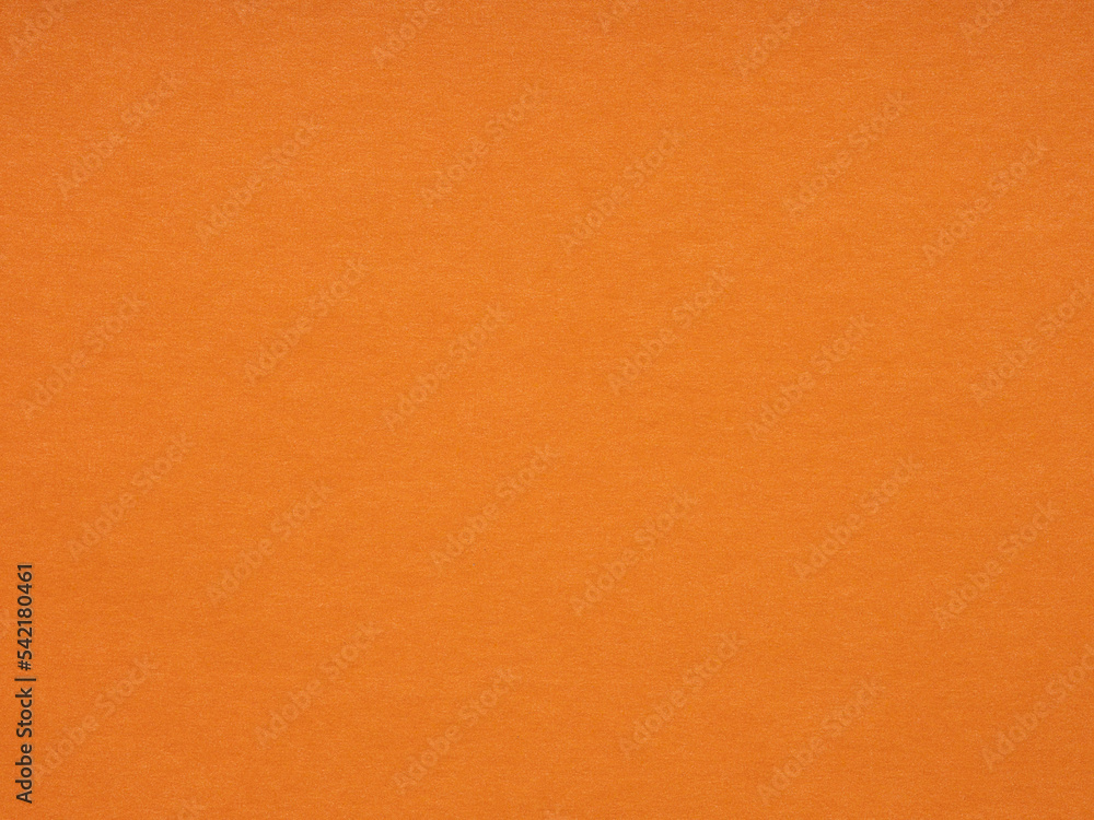 Fototapeta premium Orange paper, cardboard texture. Effect for winter season festival card, patchwork, new year designs decoration, background concepts, text, lettering, wall screen saver or other art work. Blank page.
