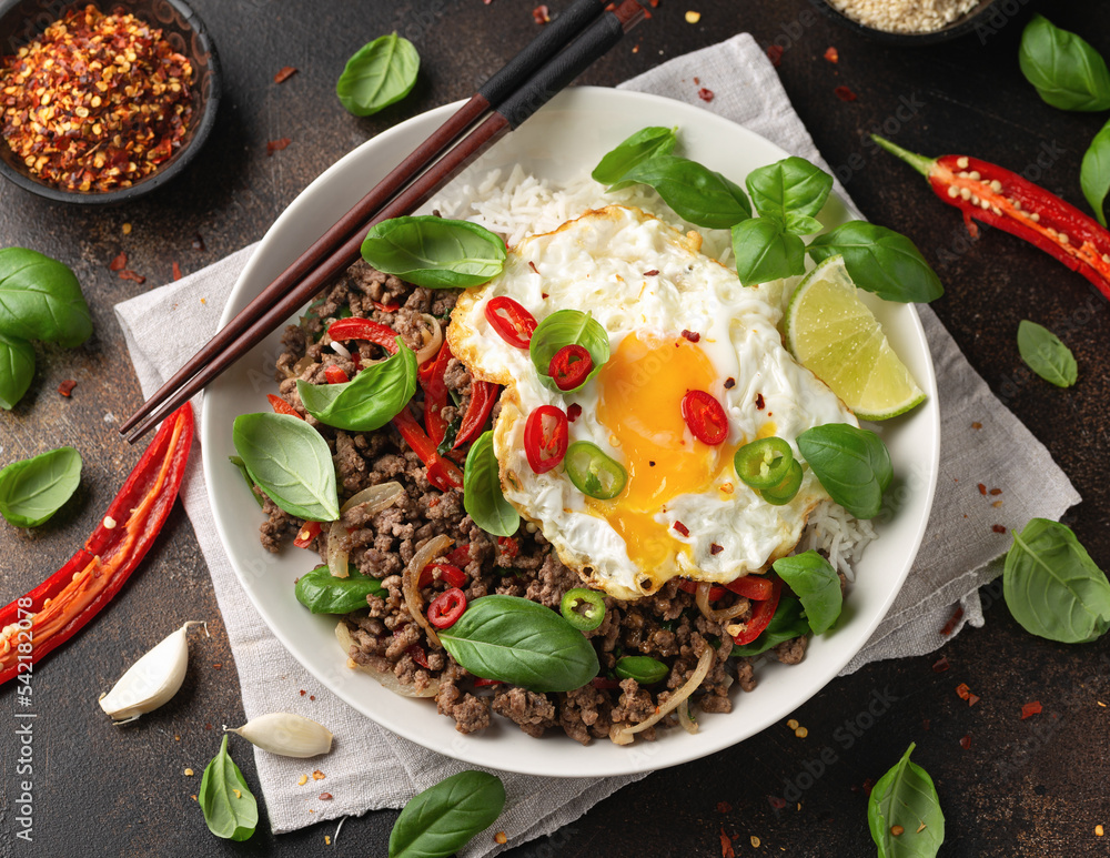 Stir Fried Pad Kra Pao with rice and egg in white plate - obrazy, fototapety, plakaty 