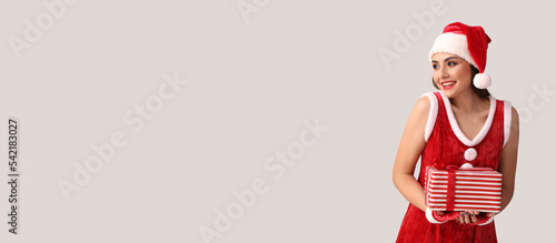 Sexy young woman in Santa c...
