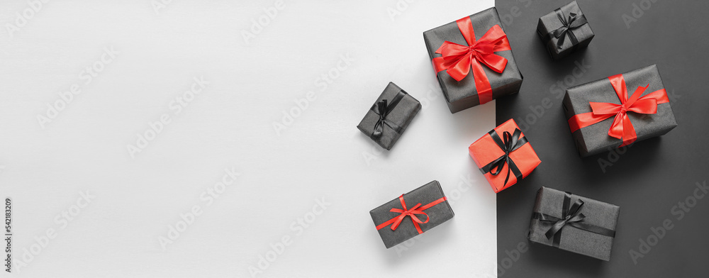 Gift boxes on light background with space for text. Black Friday sale Gift boxes on light background with space for text. Black Friday sale