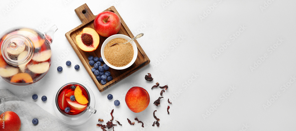 Tasty fruit tea with sugar on light background with space for text Tasty fruit tea with sugar on light background with space for text