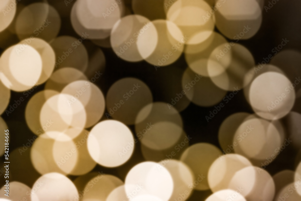 beautiful abstract background - highlights from a garland, a blurry image of a warm yellow bokeh beautiful abstract background - highlights from a garland, a blurry image of a warm yellow bokeh