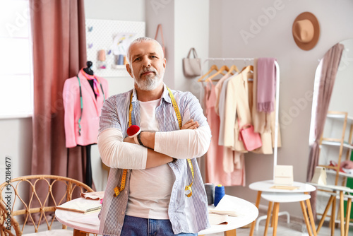 Mature fashion designer in ...