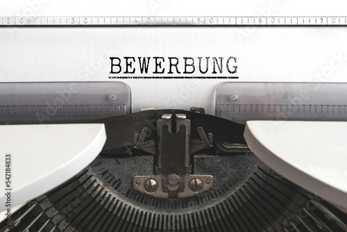 close-up view of word BEWERBUNG, German for job application, written on old mechanical typewriter