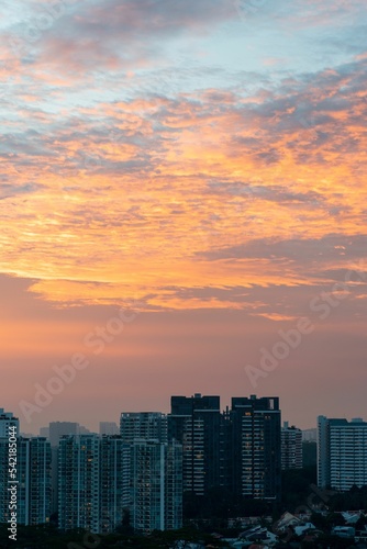 Vertical shot of a beautiful sunset over the residential building