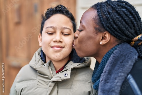 African american mother and son smiling confident standing together kissing at street