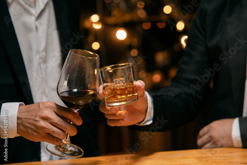 Valokuvatapetti Celebrate whiskey on a friendly party in  restaurant