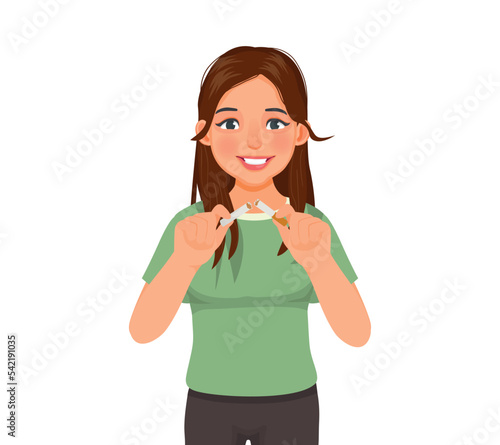 Beautiful young woman breaking cigarette for stop smoking concept
