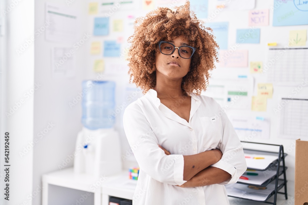 African american woman business worker standing with arms crossed gesture at office African american woman business worker standing with arms crossed gesture at office