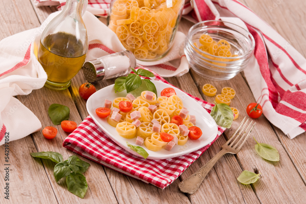 Ruote pasta with tomato and ham. Ruote pasta with tomato and ham.