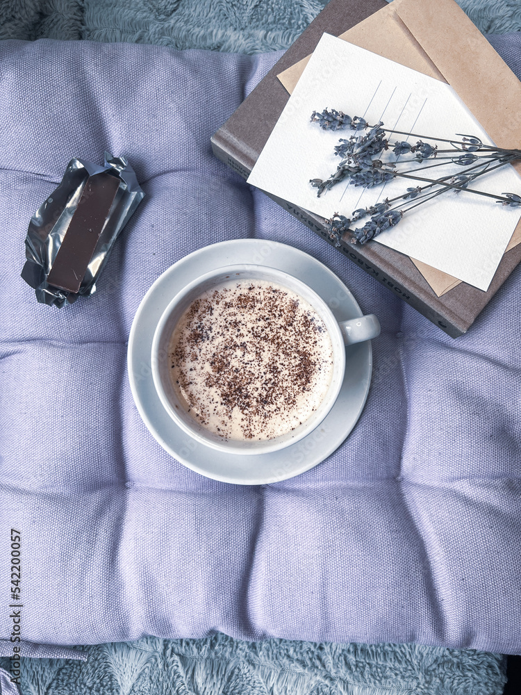 Cup of coffee and lavender flowers