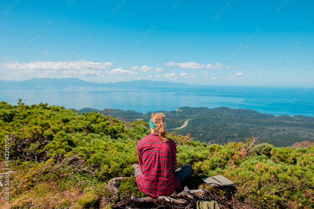 Naklejka premium Mountaintop tourist
