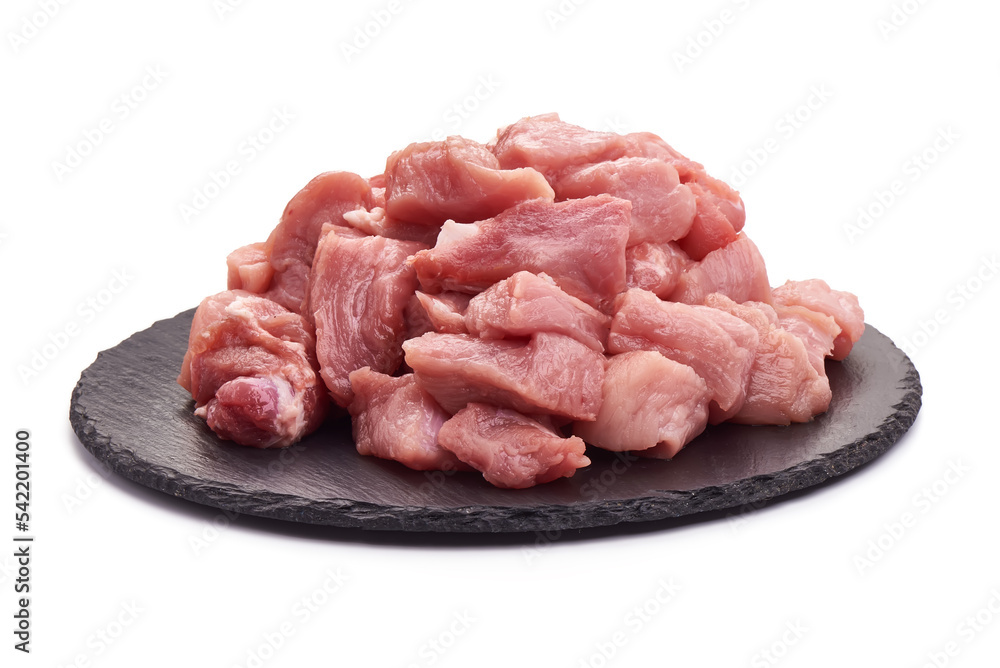 Raw fresh meat pieces, ingredients for goulash, isolated on white background. High resolution image.