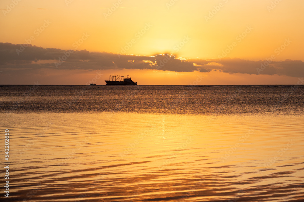 Sunset over fishing boats and commerical tankers, Tombeau Bay, Mauritius