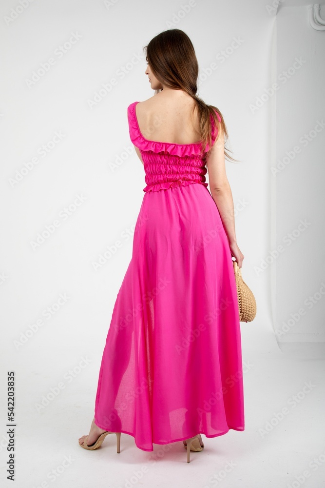 Stunning model posing in a pink maxi skirt set