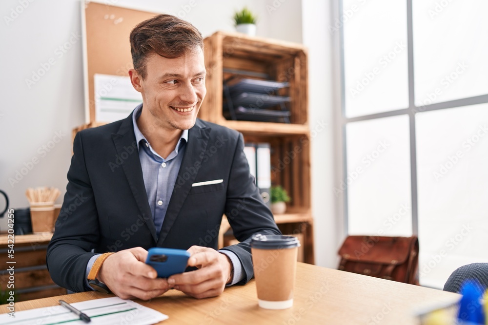 Young man business worker using smartphone working at office Young man business worker using smartphone working at office