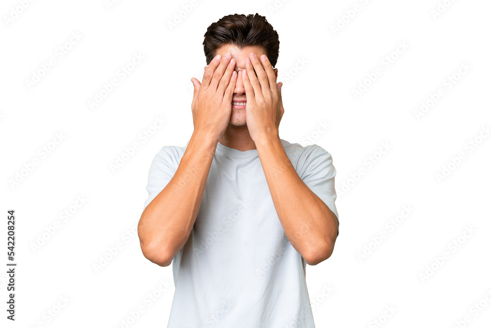 Young caucasian handsome man over isolated background covering eyes by hands Young caucasian handsome man over isolated background covering eyes by hands