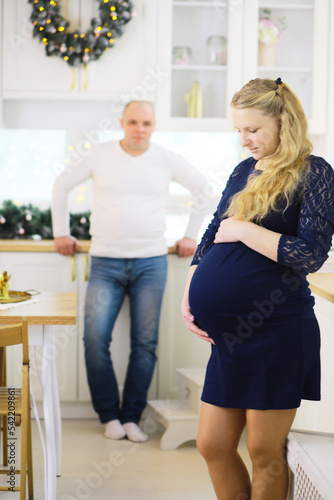 Young family couple pregnancy. A woman with a big belly. Husband and wife are expecting children.