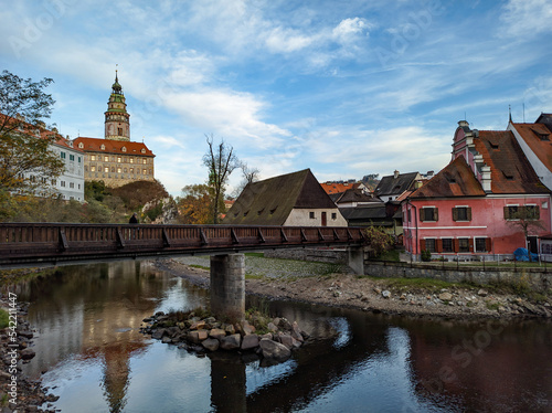 Picturesque autumn cityscape of Cesky Krumlov overlooking its historic centre and ancient Castle on bank of Vltava river, Czech Republic © scimmery1