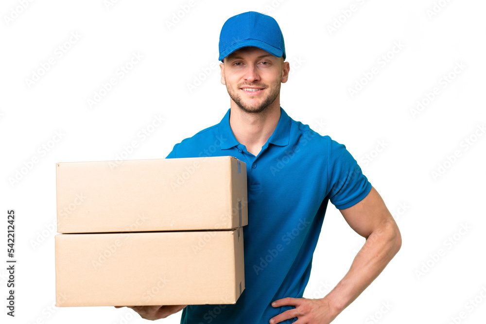 Delivery caucasian man over isolated background posing with arms at hip and smiling Delivery caucasian man over isolated background posing with arms at hip and smiling