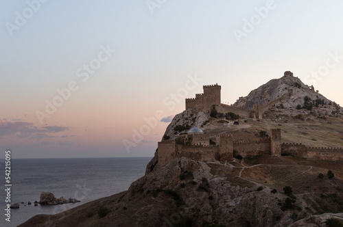 ancient fortress on mountain by sea at sunset. Crimea  Sudak
