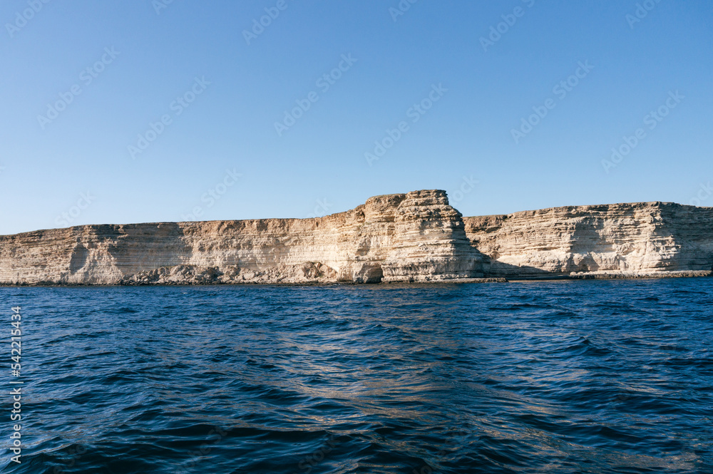 rocky seashore. waves in the sea in sunny weather