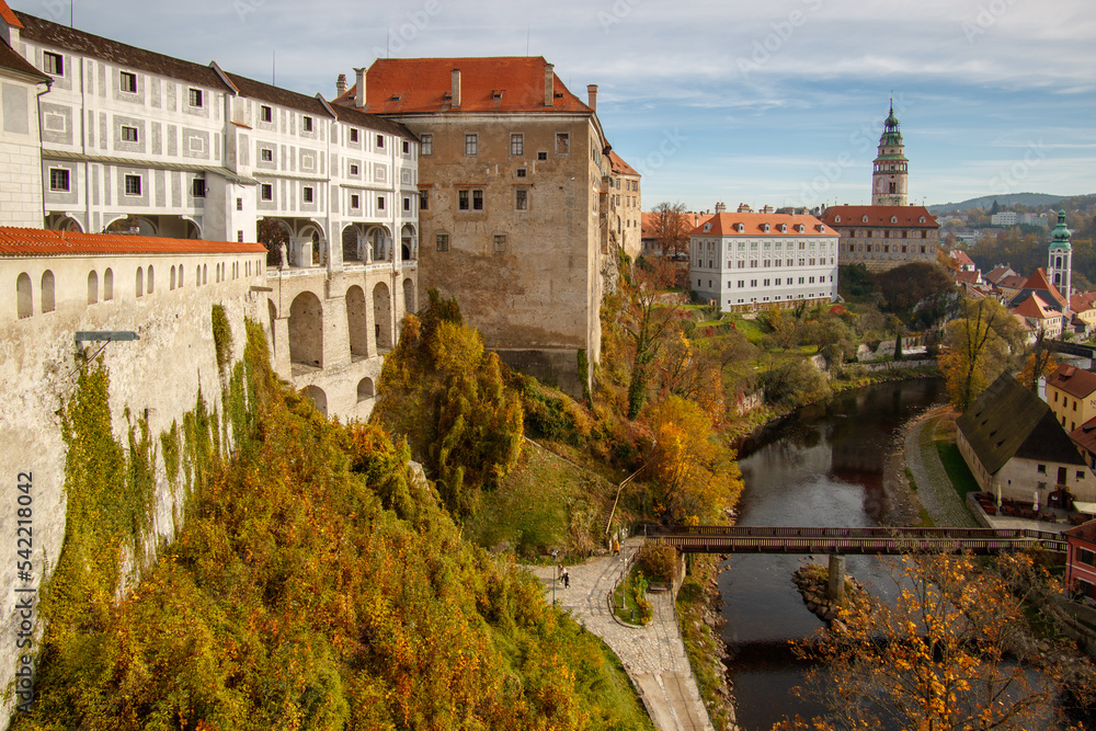 Picturesque autumn cityscape of Cesky Krumlov overlooking its historic centre and ancient Castle on bank of Vltava river, Czech Republic