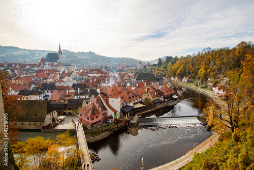 Picturesque autumn cityscape of Cesky Krumlov overlooking its historic centre and ancient Castle on bank of Vltava river, Czech Republic