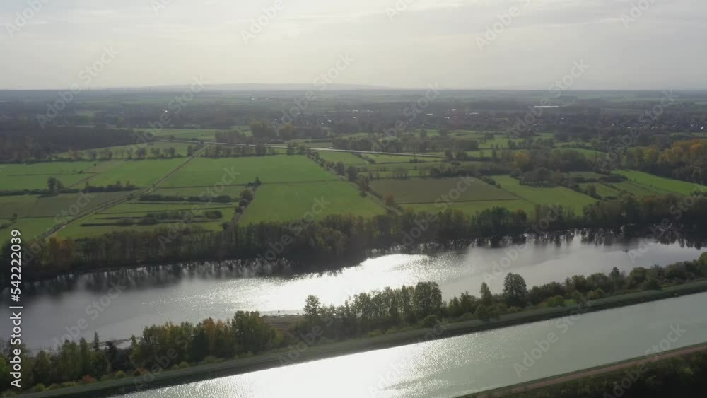 Aerial view of Mittellandkanal, a canal for industrial and commercial navigation in the flat landscape in the north of Germany Aerial view of Mittellandkanal, a canal for industrial and commercial navigation in the flat landscape in the north of Germany