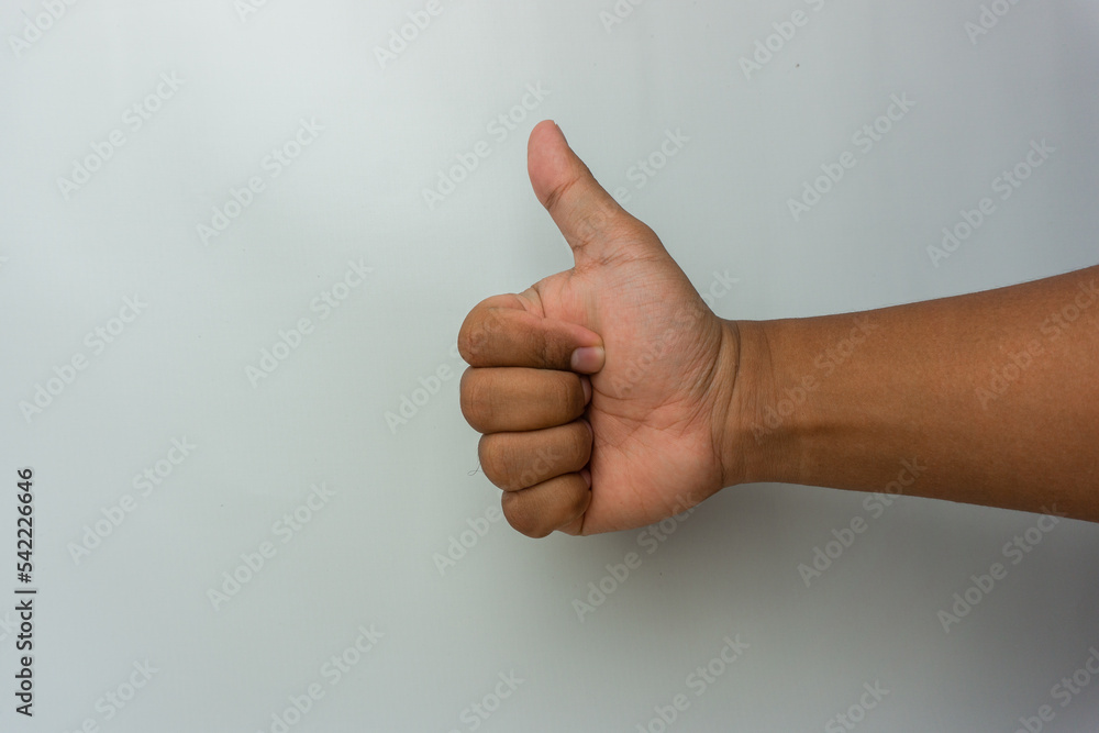 male hand showing thumbs up gesture. thumbs up sign