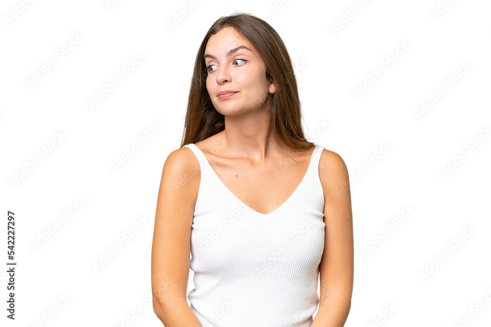Young pretty woman over isolated background making doubts gesture looking side Young pretty woman over isolated background making doubts gesture looking side